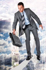 businessman walking a slackline