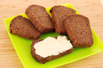 delicious sandwiches on plate on wooden background