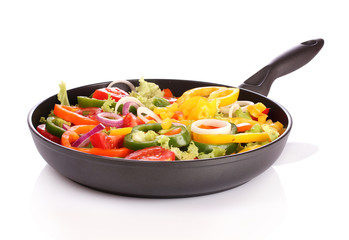 sliced ​​vegetables in a pan isolated on white