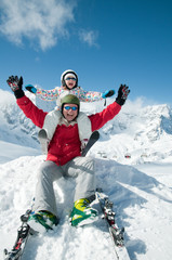 Ski, snow, sun and fun - happy family on winter vacation