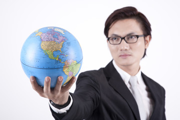 Confident Asian Businessman with Globe