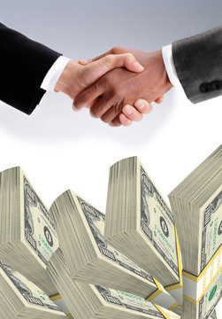 Businessman handshake with dollar stacks