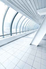 airport interior, vanishing walkway with transparent wall
