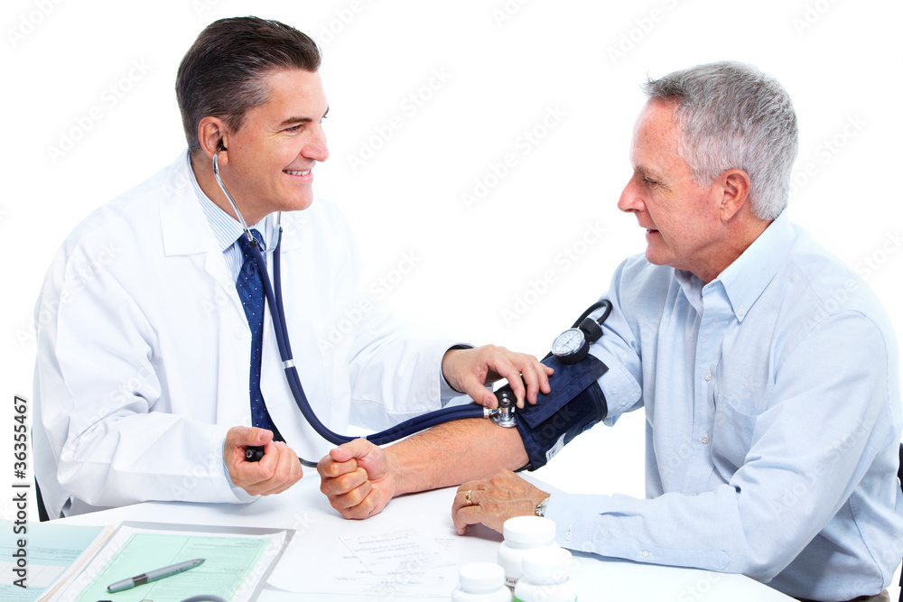 Wall mural Doctor measuring blood pressure.