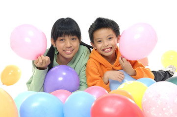Fototapeta na wymiar Adorable young couple children with colorful balloons