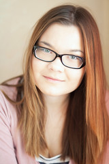 Fototapeta premium Black-rimmed glasses on the girl.