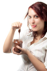 Fototapeta premium Greedy Woman Taking Chocolate Spread from a Jar
