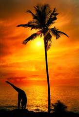 Yoga silhouette at ocean