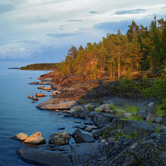 Evening at stony shore of Ladoga lake