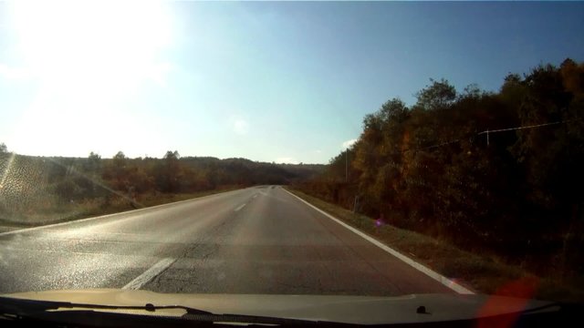 Car driving thru landscape time lapse