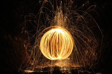 burning sphere and melt iron drops in a dark tunnel