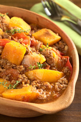Pumpkin, tomato, mincemeat dish with fresh thyme