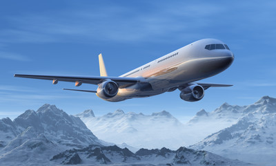 Fototapeta na wymiar Morning airliner flight over the snowy mountain peaks