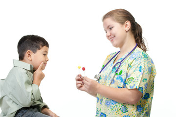 Fototapeta premium Nurse gives boy a choice of candy.