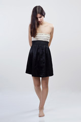 Arrested barefoot girl with arms crossed