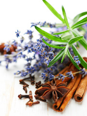 Assorted spices, rosemary and lavender flowers