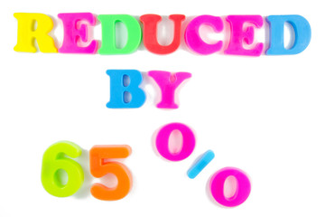 reduced by 65% written in fridge magnets