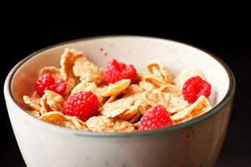 Cornflakes with milk and raspberries