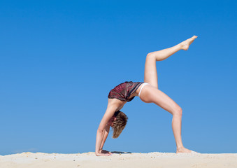 Fototapeta na wymiar Beautiful young woman in yoga pose