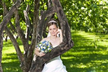 Bride behind a tree