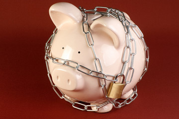 piggy bank in chains