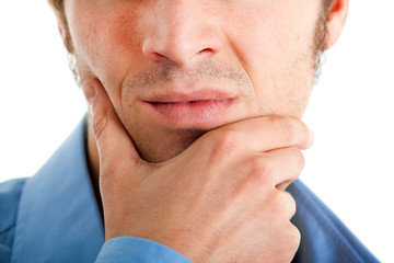 Naklejka premium Businessman with hand on his chin