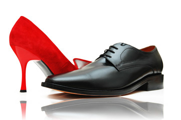 Male and female shoes on white