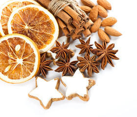 cinnamon sticks, anise stars and sliced of dried orange