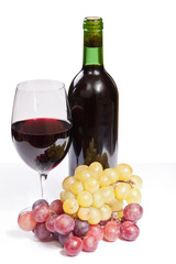 Botella de vino, copa y uvas