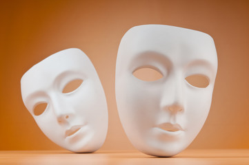 Theatre concept with masks against background