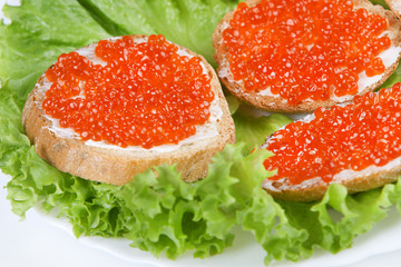 Three sandwich with red caviar