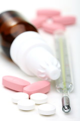Medical thermometer and medication.