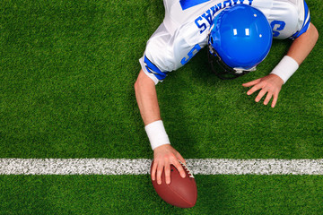 Overhead American football player one handed touchdown - obrazy, fototapety, plakaty