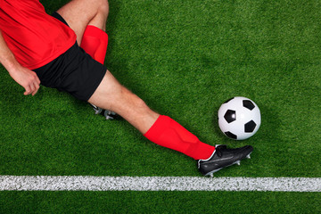 Overhead football player sliding