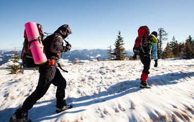 Fototapeta na wymiar Hiker in winter mountains
