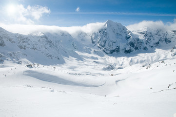Fototapeta na wymiar Winter mountains and ski slopes - space for text