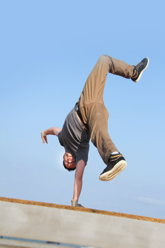 male break dancer on sky background