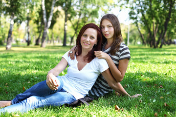 Mother with her daughter in summer park