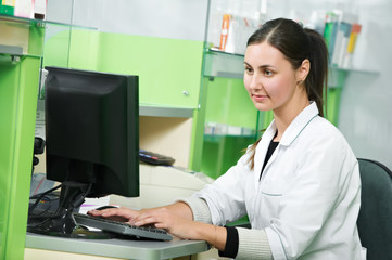 Pharmacy chemist woman in drugstore