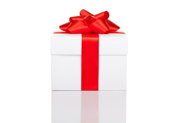 gift box with red ribbon bow isolated over white background