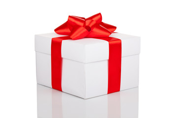 gift box with red ribbon bow isolated over white background