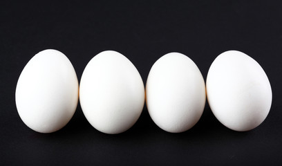 Eggs isolated on black background