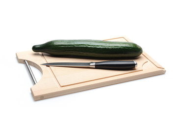 green cucumber on wooden board isolated. sushi ingredients