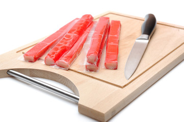 red crab stick on wooden board. sushi ingredients