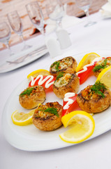 Stuffed mushroom served in the plate