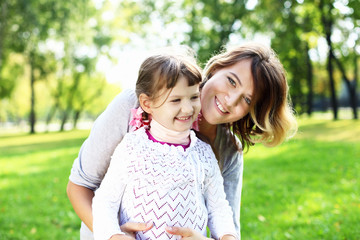 Mother and daughter in park