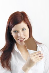 beautiful young woman with a block of chocolate