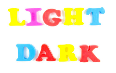 light and dark written in fridge magnets