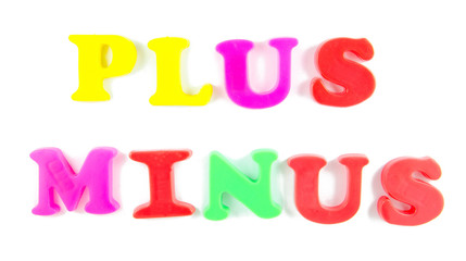 plus and minus written in fridge magnets