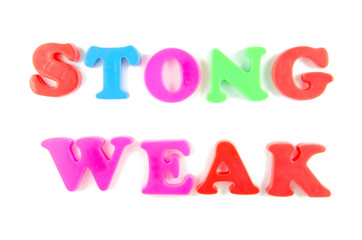 strong and weak written in fridge magnets
